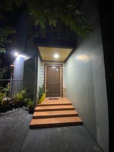 a front door of a house at night at Maeganbeverly's Place in Santa Fe