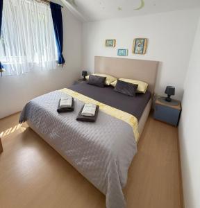 a bedroom with a large bed in a room at Villa Kale Apartments in Slatine +57 photos
