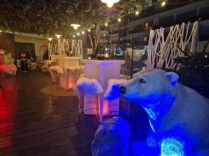 a large polar bear statue in a room with lights at Mercure Toulouse Centre Saint-Georges in Toulouse