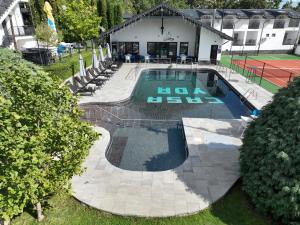 an overhead view of a swimming pool with a no laws sign at Casa YDA in Horezu