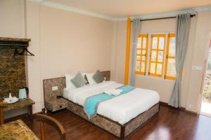 a bedroom with a bed in a room at Nagarkot Zip Coaster Pvt Ltd in Nagarkot