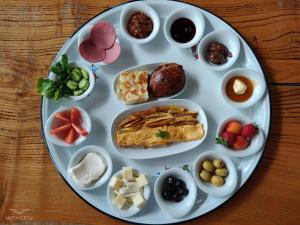 a plate of food with different types of food at City Bungalow Hotel in Edirne +12 photos