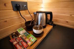 a table with a coffee pot and some food on it at City Bungalow Hotel in Edirne