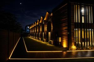a row of buildings on a street at night at City Bungalow Hotel in Edirne