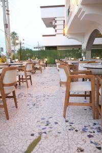a row of tables and chairs in a restaurant at Italy hotel in Silifke