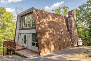 a tiny house with a brick wall at 1186 Fairway Drive: Country Squire in Basye