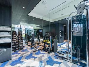 a gym with treadmills and exercise equipment in a building at Hotel Waterloo Singapore - Handwritten Collection in Singapore