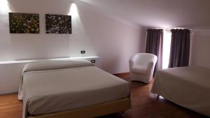 Postel nebo postele na pokoji v ubytování Park Hotel San Michele