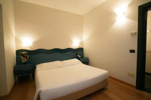 Postel nebo postele na pokoji v ubytování Hotel Antico Mulino
