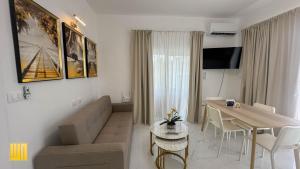 a small living room with a couch and a table at 2JA Management Group - Condos White Hill in Sosúa