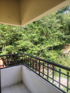 a balcony with a view of trees at El Renacer in San Gil