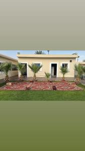 a house with palm trees in front of it at استراحة لايك لاين ديراب in Ar Riyāḑ +28 photos