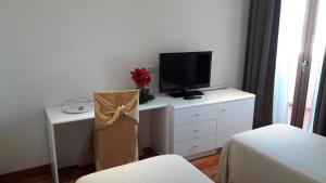 TV a/nebo společenská místnost v ubytování Park Hotel San Michele