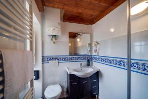 a bathroom with a sink and a toilet at Dimora Santa Barbara in Matera