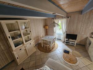 an overhead view of a kitchen with a table and a television at penty vero in Plobannalec-Lesconil