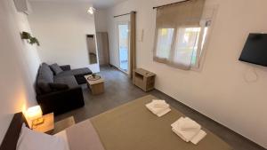 an overhead view of a living room with a couch at Anemos Comfort Living in Paralia Panteleimonos