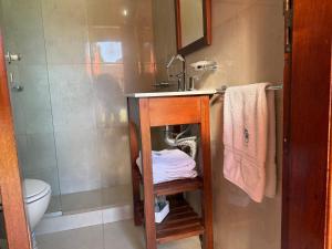 a bathroom with a sink and a toilet at Complejo Foecyt Santa Fe in Colastiné +23 photos