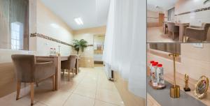a kitchen and dining room with a table and chairs at Hotel Rion in Mangalia
