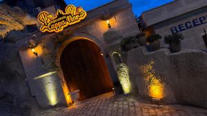 an entrance to a restaurant with a sign over a door at Cappanar Cave in Nar