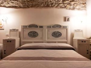 a bedroom with a bed with two night stands at Masseria La Guardata in Guglionesi +36 photos