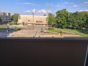 a view from a window of a parking lot at Centralhome in Miskolc +2 photos