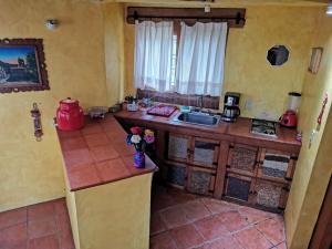 a kitchen with a counter and a sink in a room at Private Stunning Cottage In Forest Cuernavaca CDMX in Huertas de San Pedro +28 photos