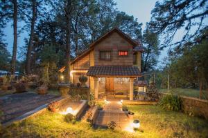 a house with a gazebo in the yard at Private Stunning Cottage In Forest Cuernavaca CDMX in Huertas de San Pedro