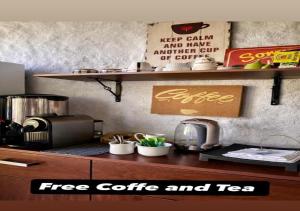 a kitchen with a counter with a coffee maker on it at Amancay House, Jacuzzi and Pool in San Cristóbal