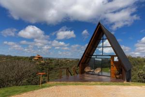 a small house with a large window on a roof at Cabanas Mirante do Cerrado1 in Brasília