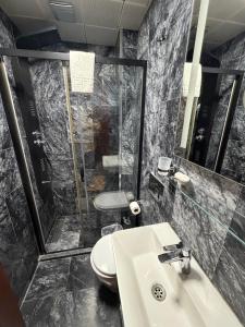 a bathroom with a sink and a shower at The Basilissis Gulhane in Istanbul +40 photos