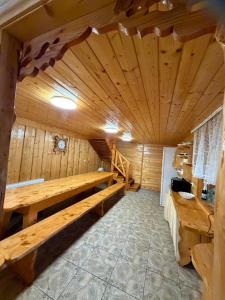 a wooden room with a bench in a sauna at KarpatskeDzerelo in Roztoky