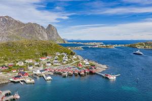 an aerial view of a harbor with boats in the water at Reine seaview cabin in Reine