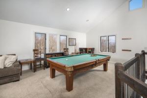 a living room with a pool table in it at Flat Top Lodge in Blowing Rock +33 photos