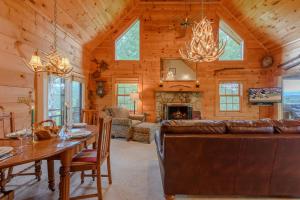 a living room with a couch and a table and a fireplace at Valle View in Valle Crucis +12 photos