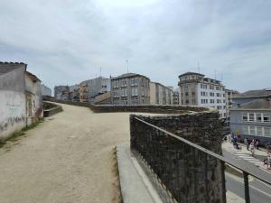 a view of a city with buildings and a wall at Luxury apartamento Muralla de Lugo 1.2 in Lugo