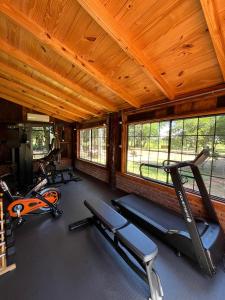 a gym with three exercise bikes in a room at Encanto Rural in Bella Vista