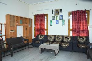 a living room with two couches and a table at jayaram Home Palace Chittoor in Chittoor
