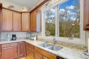a kitchen with a sink and a window at The Pointe at North View in Banner Elk