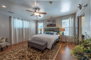 a bedroom with a bed and a ceiling fan at Red River Retreat in Paso Robles