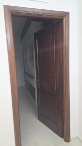 a closet with a wooden door in a room at Erminia Apartaments in Vico Equense +45 photos