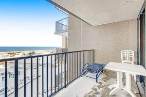 a balcony with a table and chairs and the beach at Sea Colony - 302S Edgewater in Bethany Beach