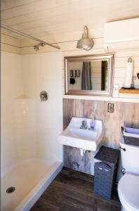 a bathroom with a sink and a tub at NEW! Unique Modern Glamping Chalet #5 in Orderville