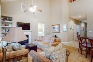 a living room with a couch and a fireplace at Bear Trap Dunes - 182 Willow Oak in Ocean View