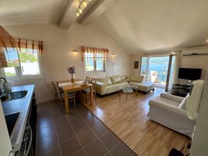 a living room with a couch and a table at Villa Mare Apartments in Tivat