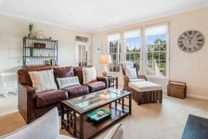 a living room with a couch and a table at Bear Trap Dunes - 56E October Glory in Ocean View