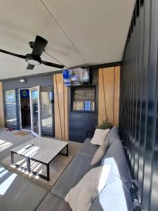 a living room with a couch and a table at MobileHome Serdar in Sveti Filip i Jakov