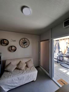 a bedroom with a bed and a sliding glass door at MobileHome Serdar in Sveti Filip i Jakov