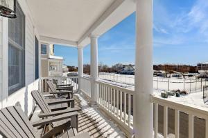 a porch with chairs and a view of the snow at Bayside Resort - 36398 Azalea Ave in Selbyville