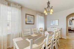 a dining room with a white table and chairs at Bayside Resort - 36398 Azalea Ave in Selbyville