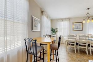 a kitchen and dining room with a table and chairs at Bayside Resort - 36398 Azalea Ave in Selbyville +35 photos